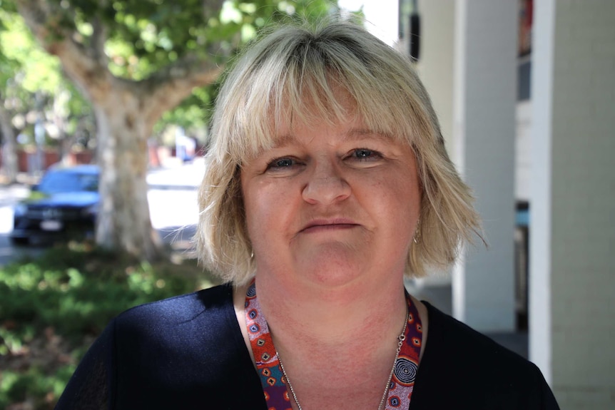 A head and shoulders shot of Bev Jowle posing for a photo.