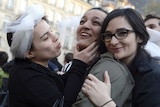 Women celebrate after same-sex marriage bill passes French National Assembly