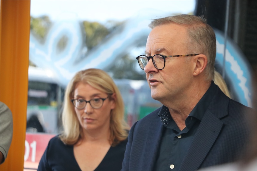 A close up shot of Anthony Albanese with Rita Saffioti behind him