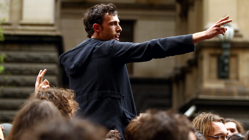 An Occupy Melbourne protester rallies the crowd. (Getty Imgaes: Mark Dadswell)