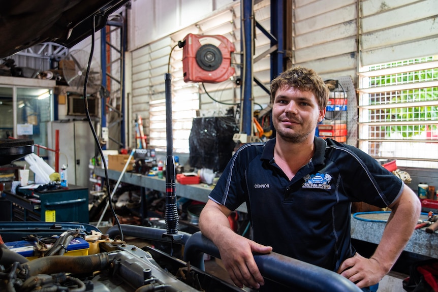 A young man stands in a mechanics workshop in Katherine. 