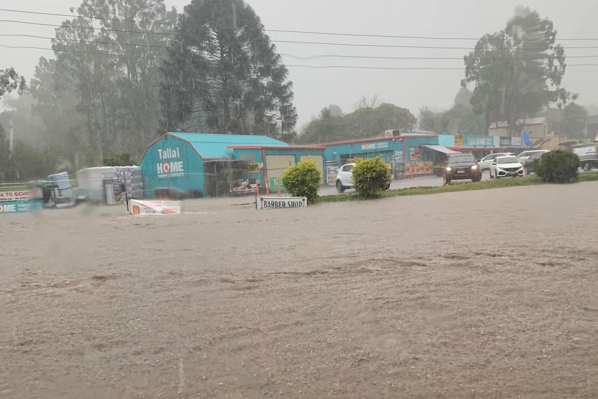 Flood water around a hardware store on the Gold Coast.