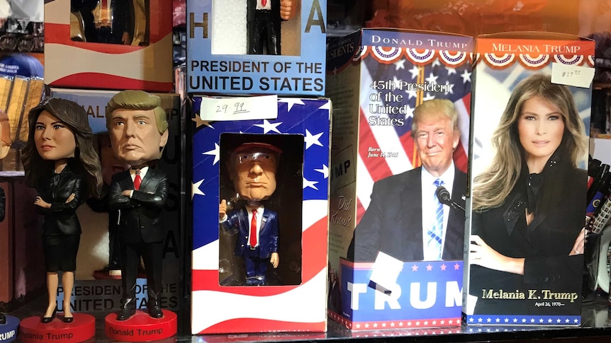 Donald Trump and Melania Trump bobblehead toys on a shelf