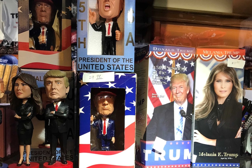 Donald Trump and Melania Trump bobblehead toys on a shelf