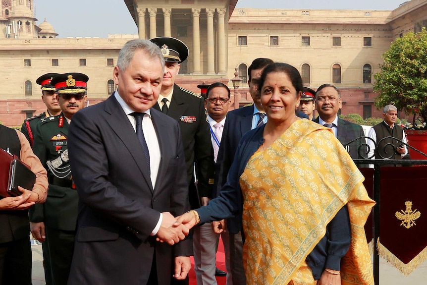 Russian Defence Minister Sergei Shoigu shakes hands with Indian Defence Minister Nirmala Sitharaman