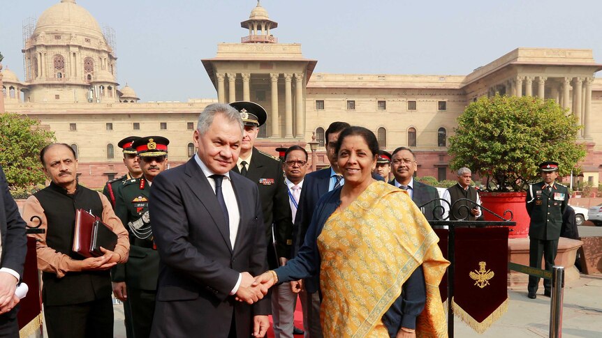 Russian Defence Minister Sergei Shoigu shakes hands with Indian Defence Minister Nirmala Sitharaman
