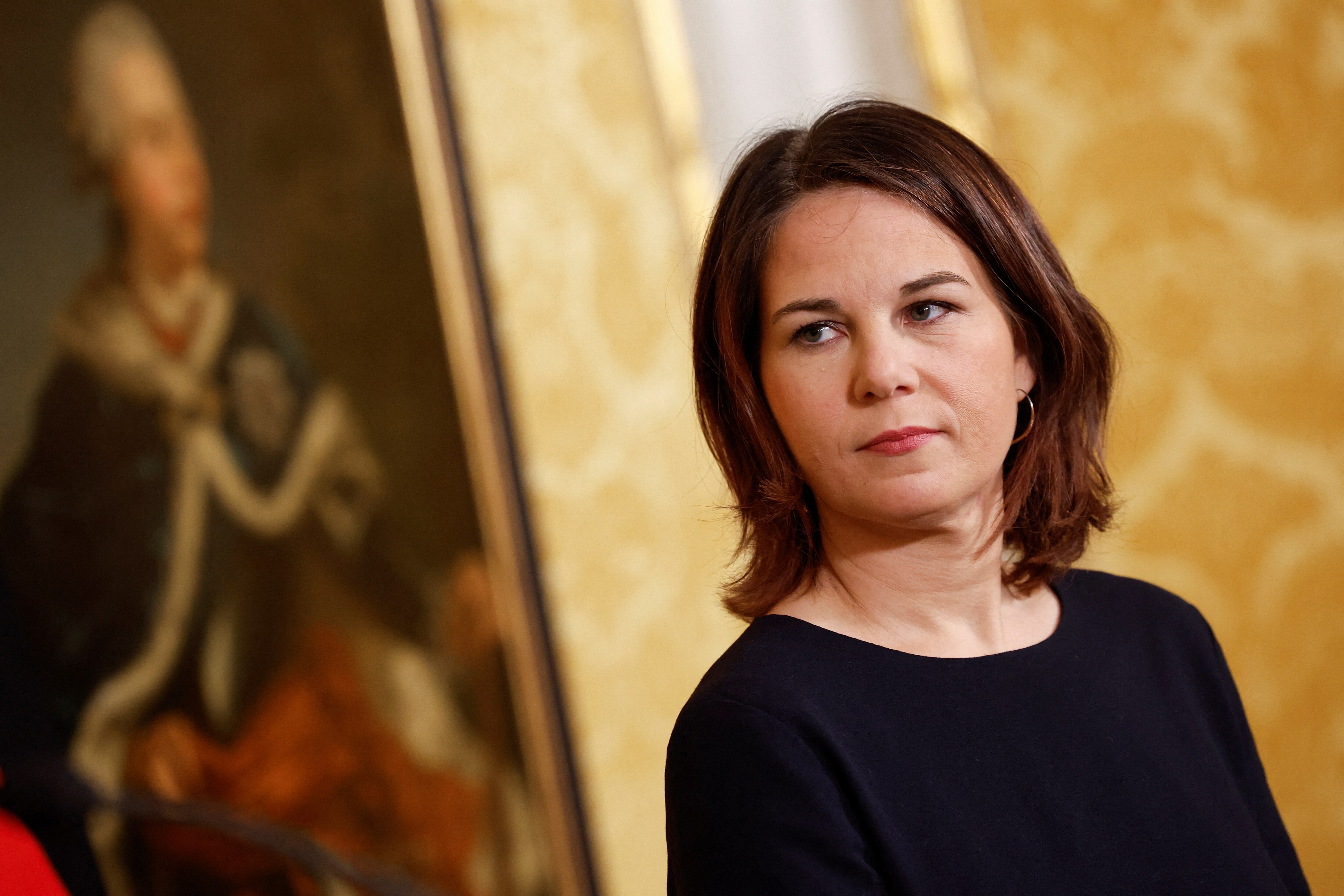German Foreign Minister Annalena Baerbock looks on during a news conference.
