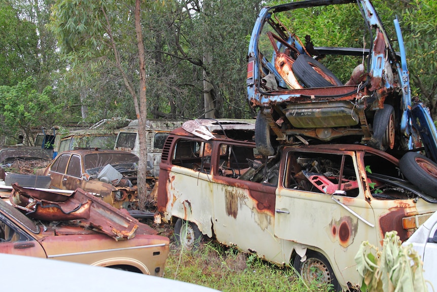 A line of rusted out VW Kombi Vans