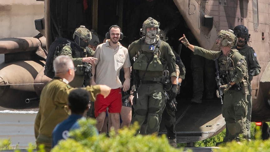 Andrey Kozlov walking out of Israeli helicopter after rescue.