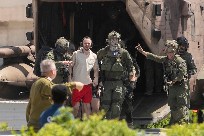Andrey Kozlov walking out of Israeli helicopter after rescue.