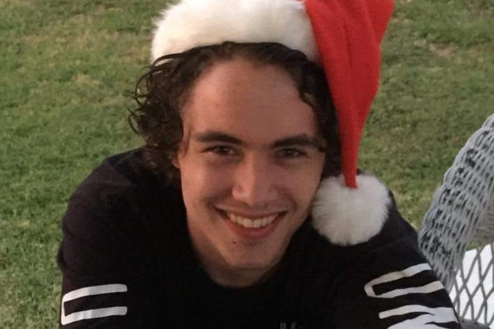 Jarrad in santa hat.