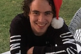 Jarrad in santa hat.