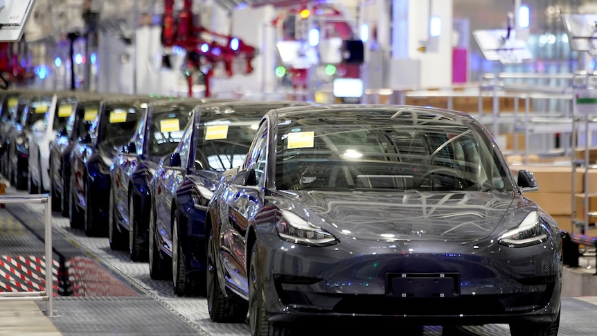 A row of Tesla Model 3s. 