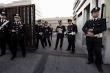 Police stand outside Rome's criminal court.