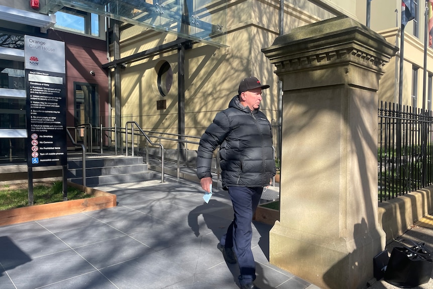 Man walking out of courthouse 