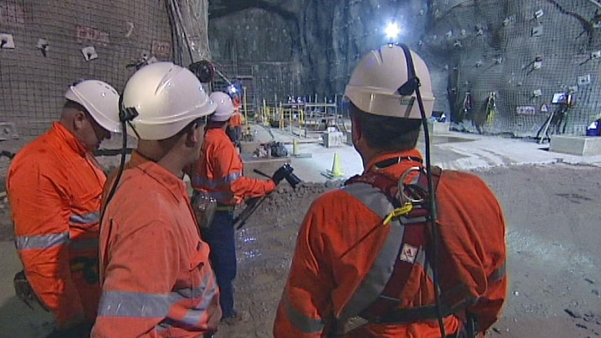 Mine workers in a tunnel