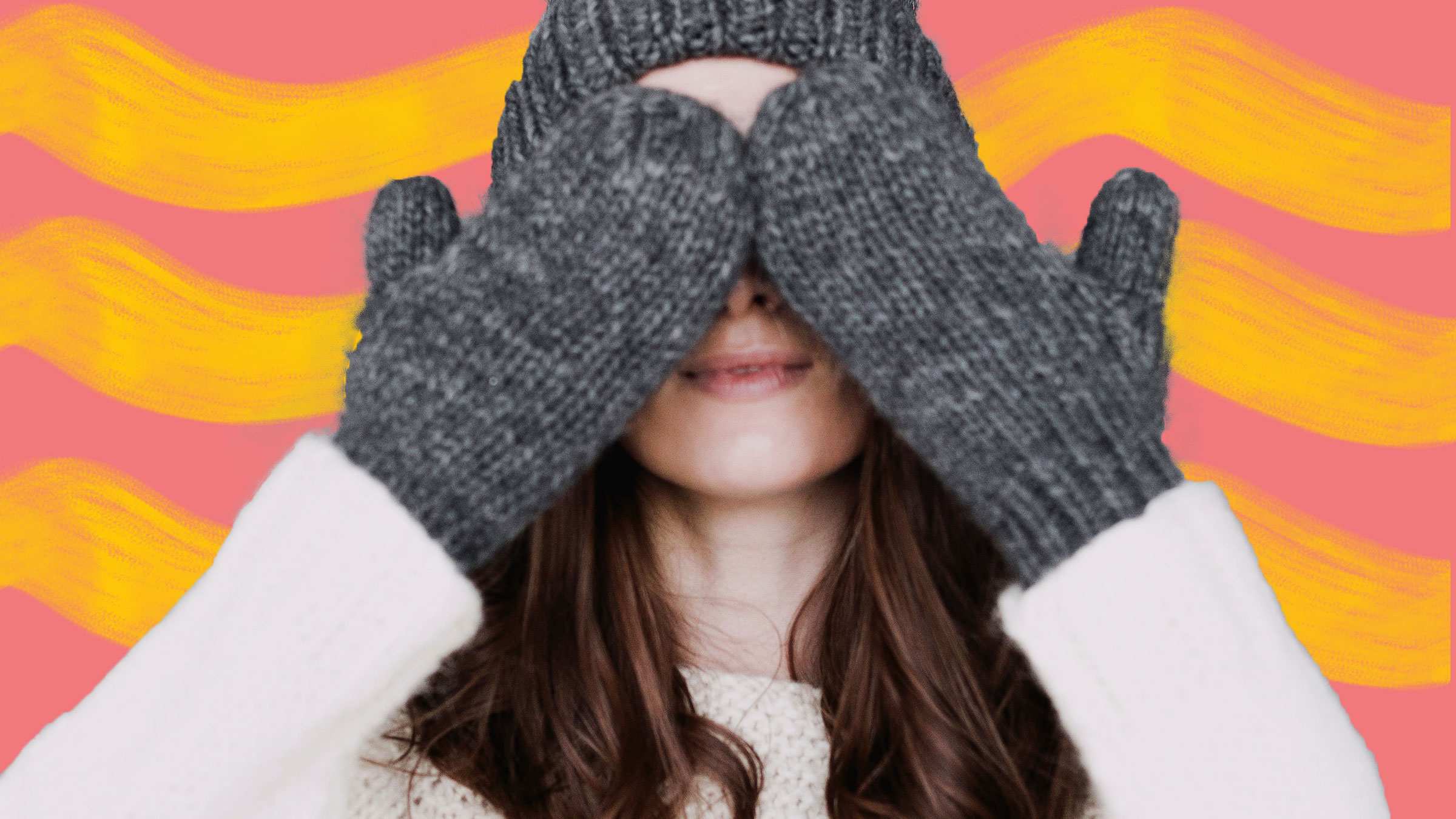 Woman in winter clothes covering her eyes for a story about how to keep warm in winter with heating