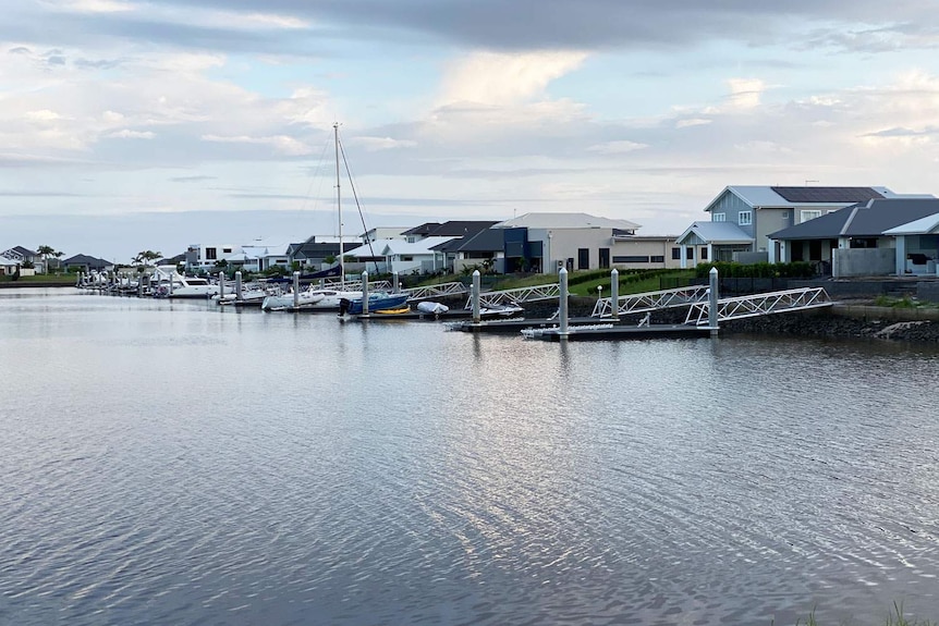 Boats and moorings in canal behind homes at Calypso Bay at Jacobs Well.