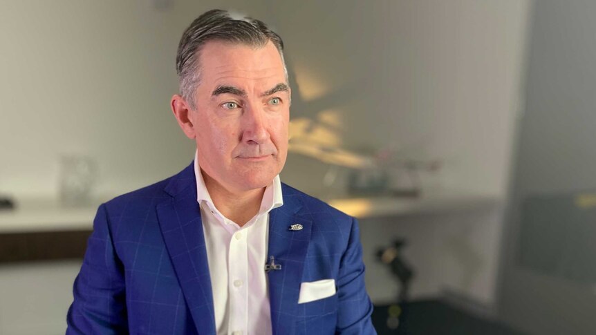 Virgin Australia CEO Paul Scurrah sits in a chair during an interview with The Business on August 28, 2019.
