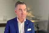Virgin Australia CEO Paul Scurrah sits in a chair during an interview with The Business on August 28, 2019.