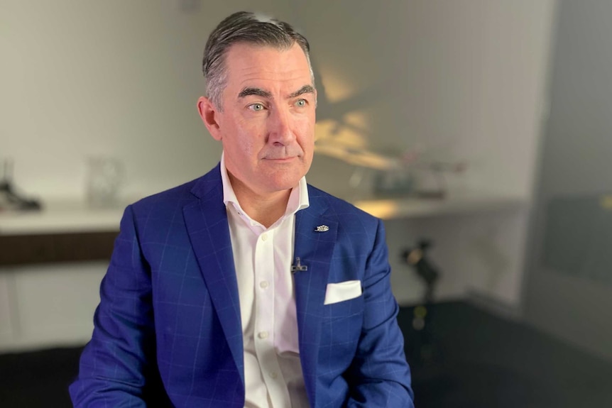 Virgin Australia CEO Paul Scurrah sits in a chair during an interview with The Business on August 28, 2019.