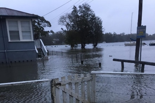 Water laps at a house