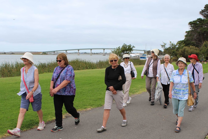 group of elderly ladies walking