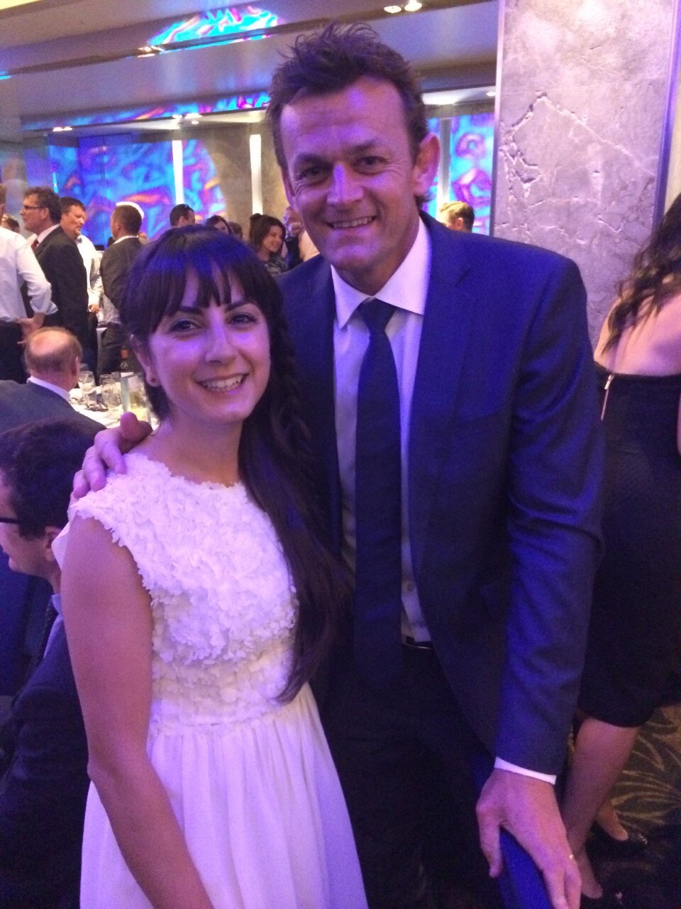 Shalala arm in arm with Gilchrist at a function.