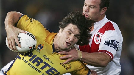 Nathan Hindmarsh of the Eels tackled by Dragons defence