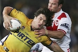 Nathan Hindmarsh of the Eels tackled by Dragons defence