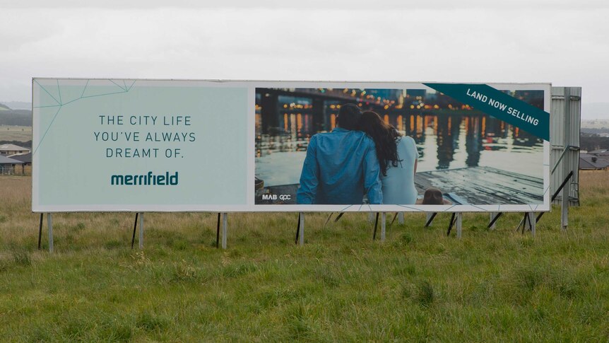A billboard selling land for the Merrifield estate in Mickleham.