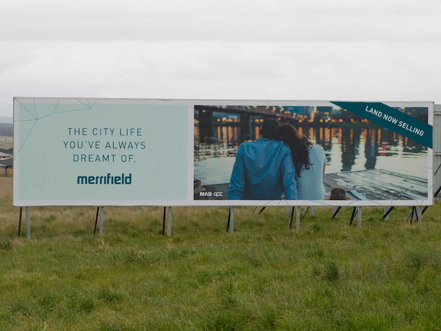 A billboard selling land for the Merrifield estate in Mickleham.