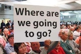 A man holds up a sign during a protest meeting in Griffith.