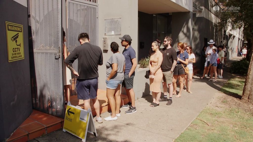 People looking to rent apartment line up to inspect property. 