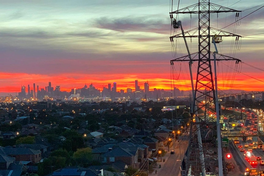The Melbourne skyline with a power line in the foreground