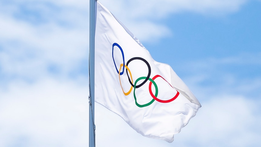 An Olympic flag flies in the air during the 2020 Tokyo Games.