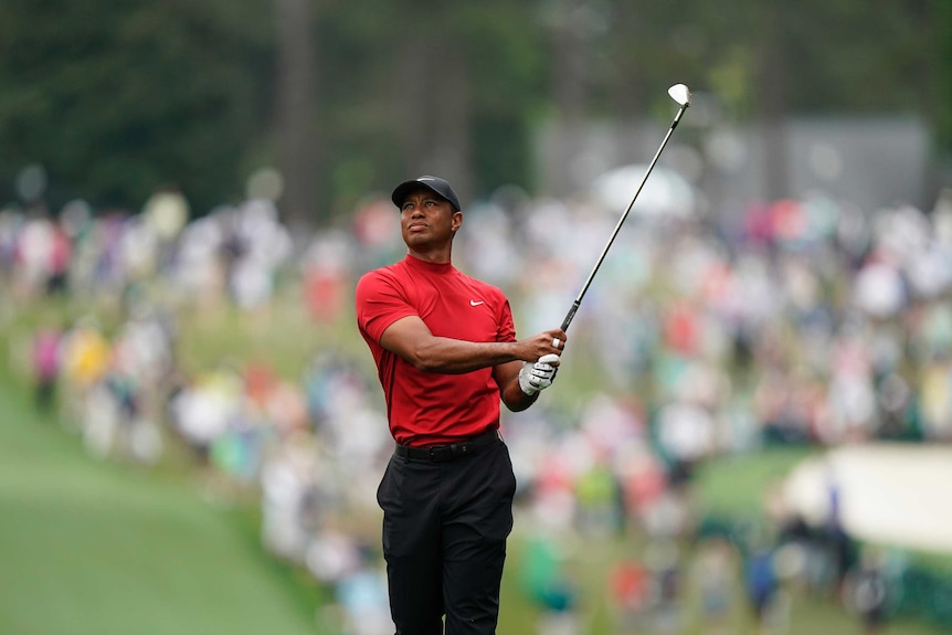 Tiger Woods hits from the first hole during the final round for the Masters golf tournament.