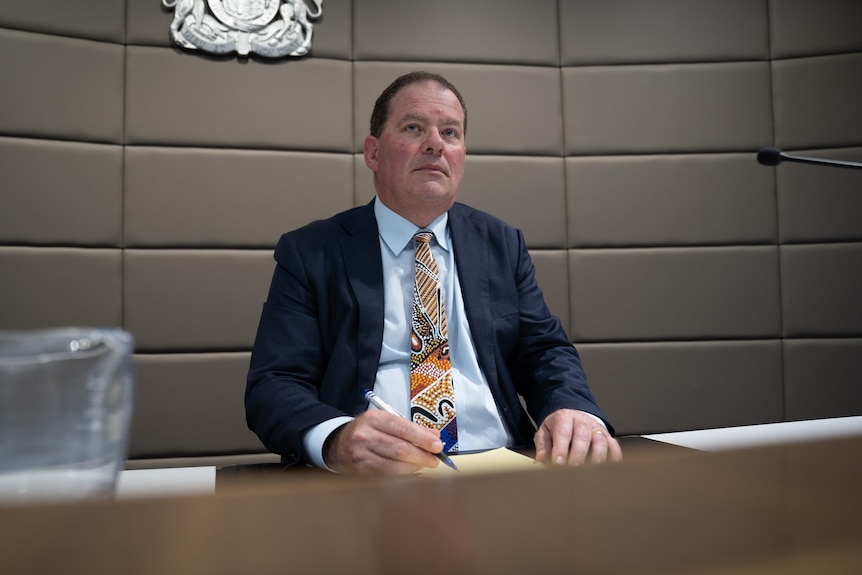 a man in a suit in a court setting