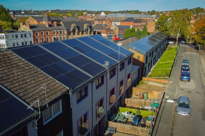 An aerial photograph showing solar panels on top of terrace houses in Nottingham.