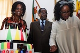 Robert Mugabe with birthday cake