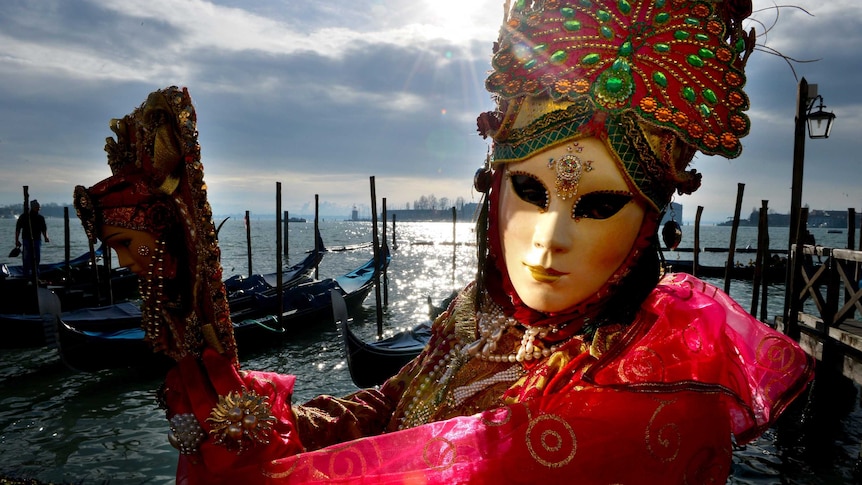 Costumed reveller at Venice carnival.