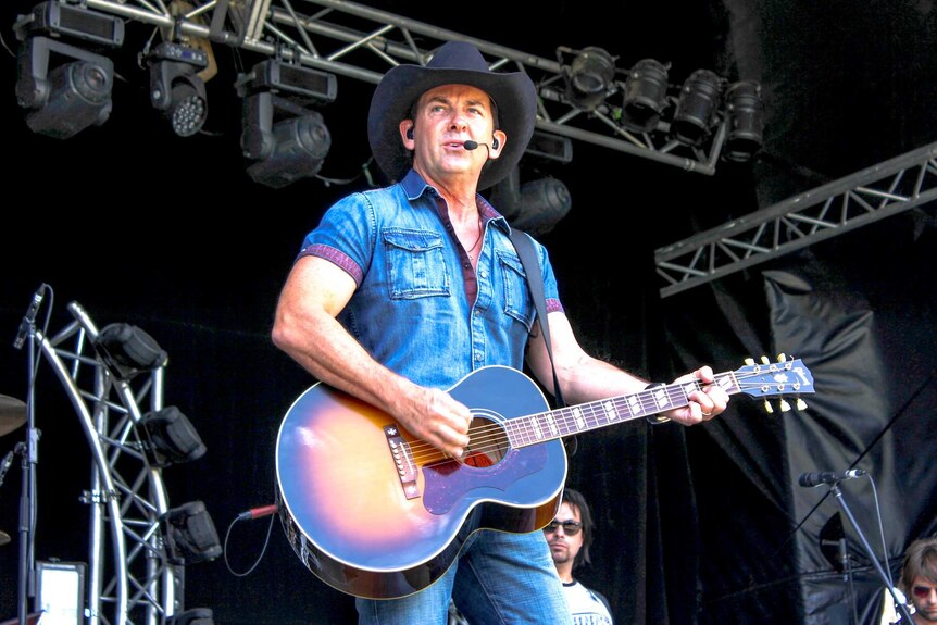 Country singer Lee Kernaghan performing onstage.
