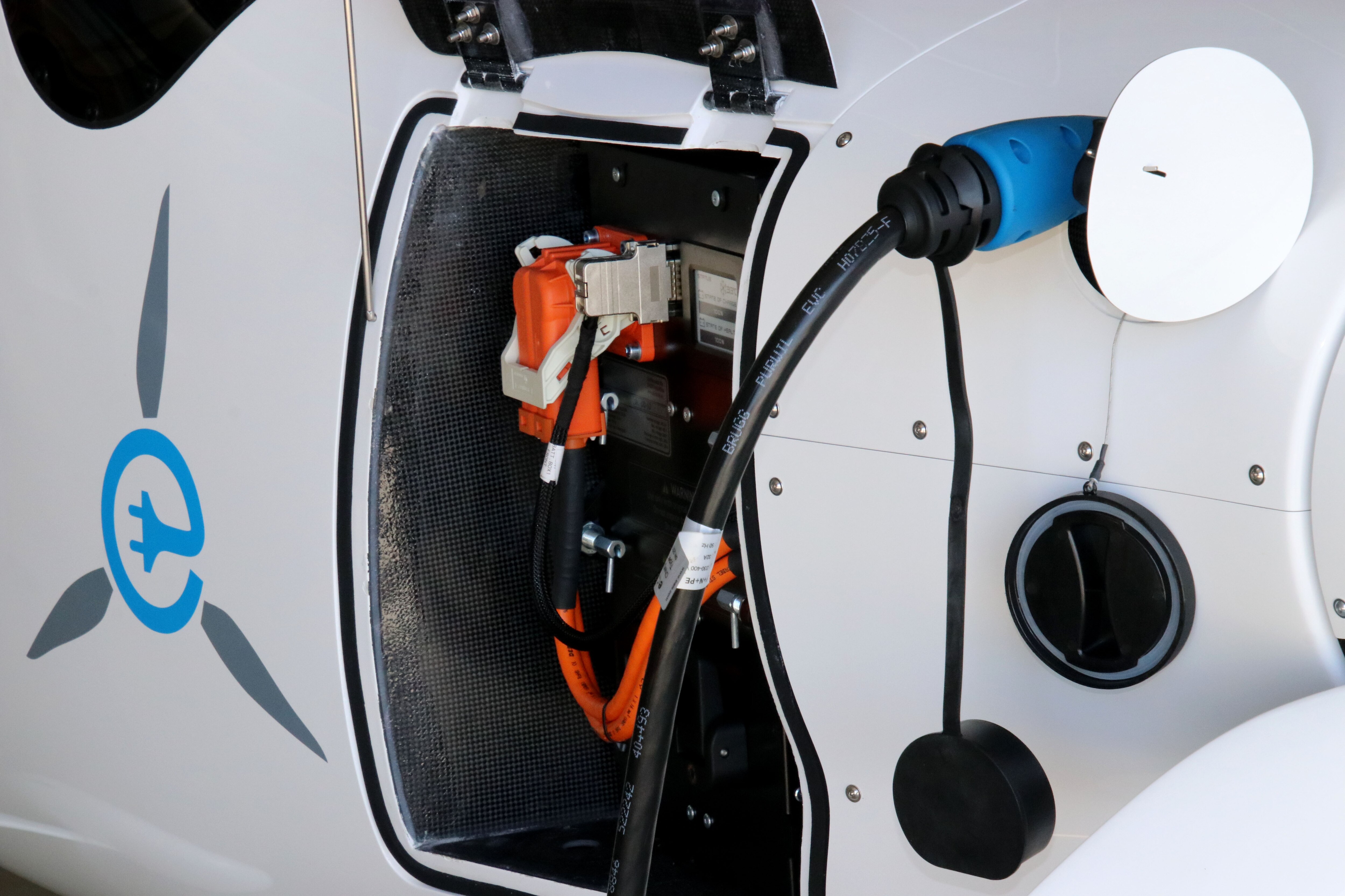 A close-up of the charging dock of an electric plane