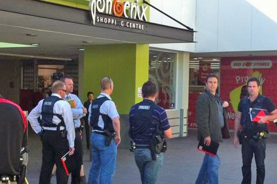 Police officers outside Phoenix shopping centre after armed robbery
