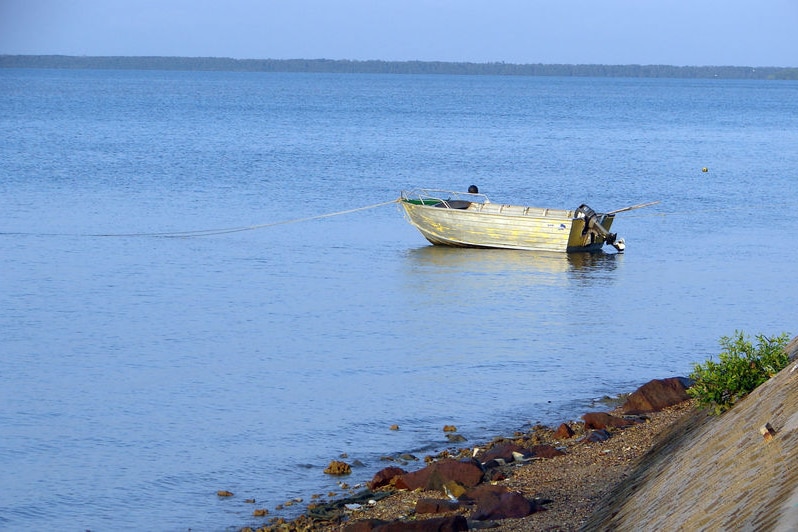 A fishing dinghy is moored off the shore of the Torres Strait island of Boigu, at the frontier between Australia and Papua New Guinea.