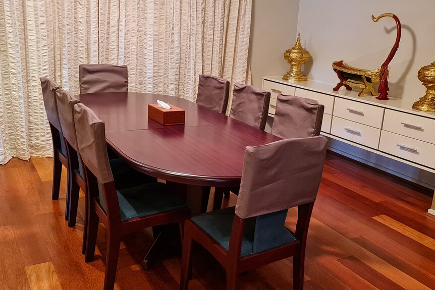 A dining table and chairs inside the new Myanmar National Unity Government mission