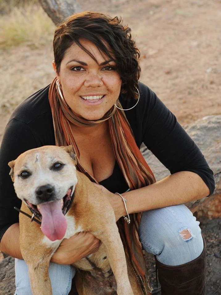 Jacinta Price and a dog photographed outdoors