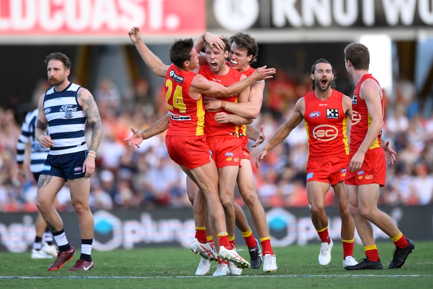 Jack Lukosius celebrates a goal for the Suns