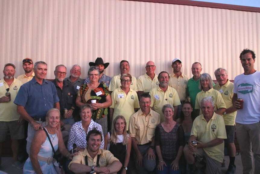 A group photo of smiling volunteers.