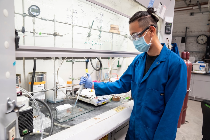 Scientist in lab creating plastic